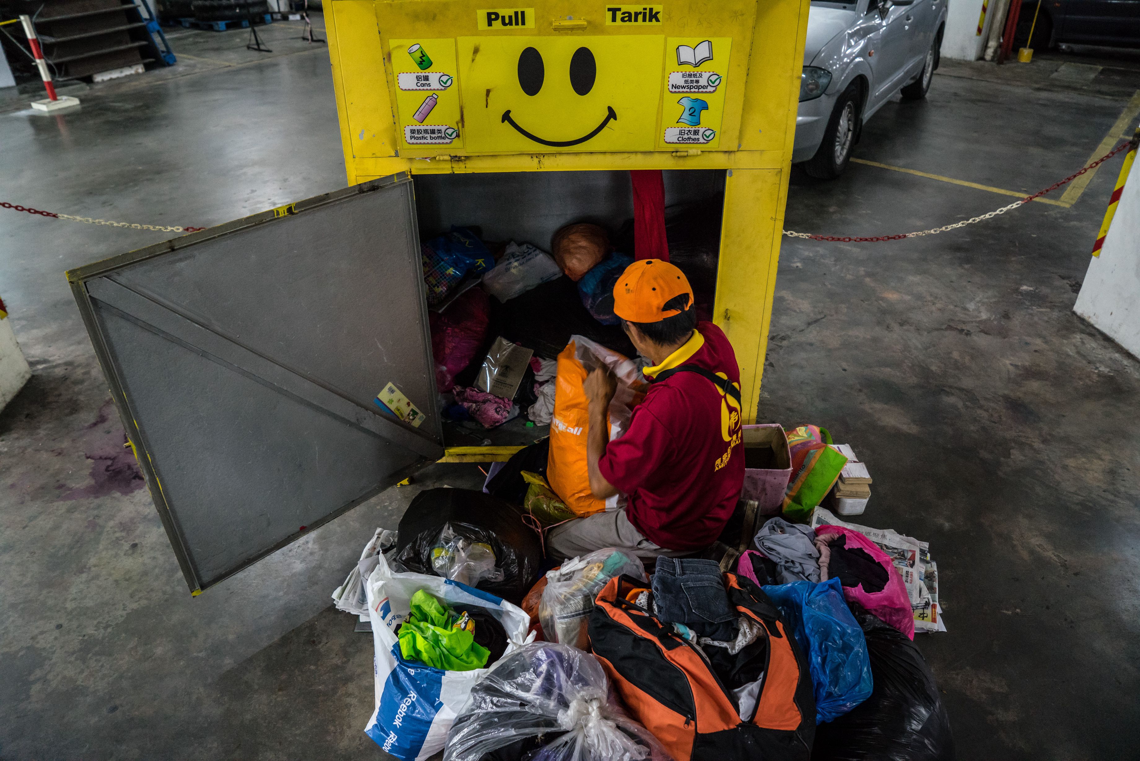 Yellow Bin team sorting donated textiles and recycle clothes at Johor Bahru sorting centre