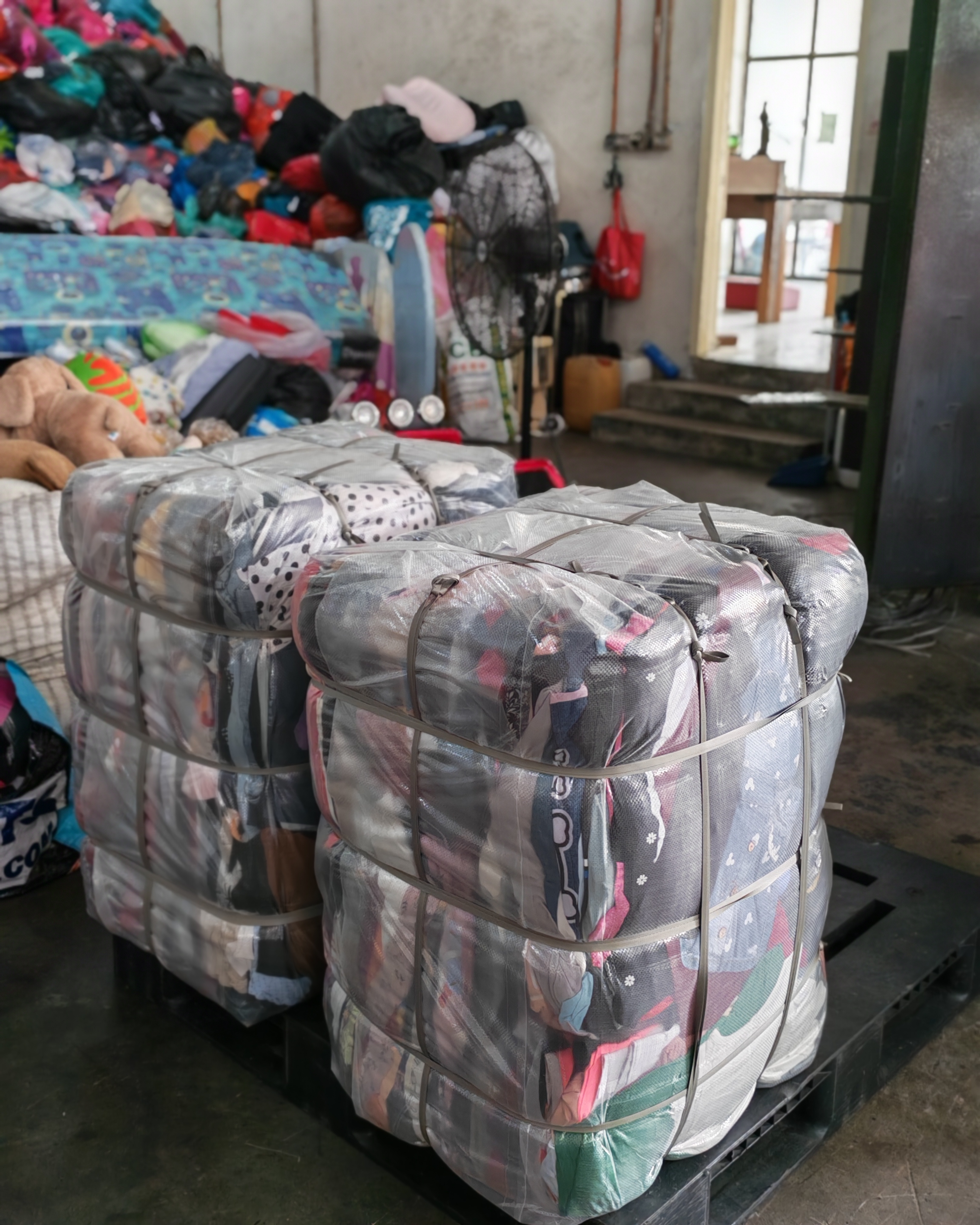 Yellow Bin staff sorting and recycling donated textiles at Johor Bahru processing centre